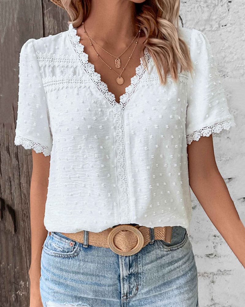 Blusa da donna in pizzo con scollo a V
