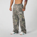 Pantaloni jogging uomo ampi con fantasia mimetica