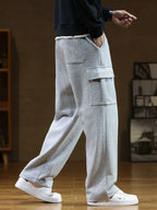 Pantaloni jogging uomo con tasca cargo e gamba ampia