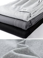 Pantaloni jogging uomo con tasca cargo e gamba ampia