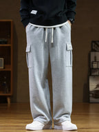 Pantaloni jogging uomo con tasca cargo e gamba ampia
