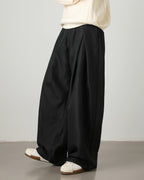 Pantaloni donna ampi con pince e cintura